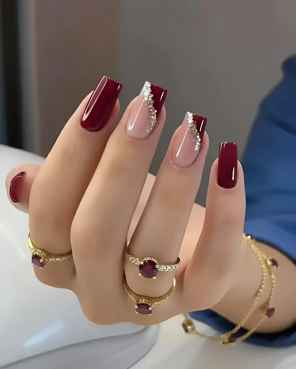 Maroon French Tips with Diagonal Rhinestone Detail