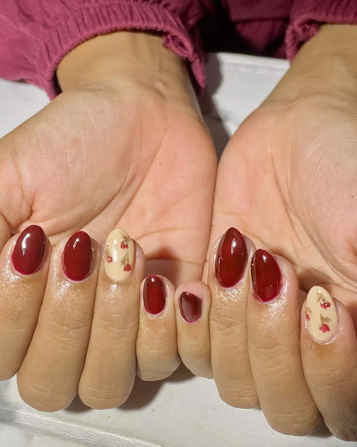 Maroon Short Nails with Beige Floral Accents