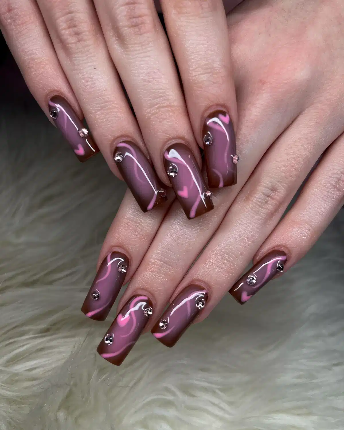 Brown-and-mauve swirls with heart accents and studs