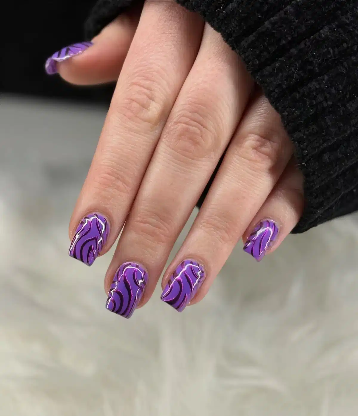 Purple swirl lines with black and white accents