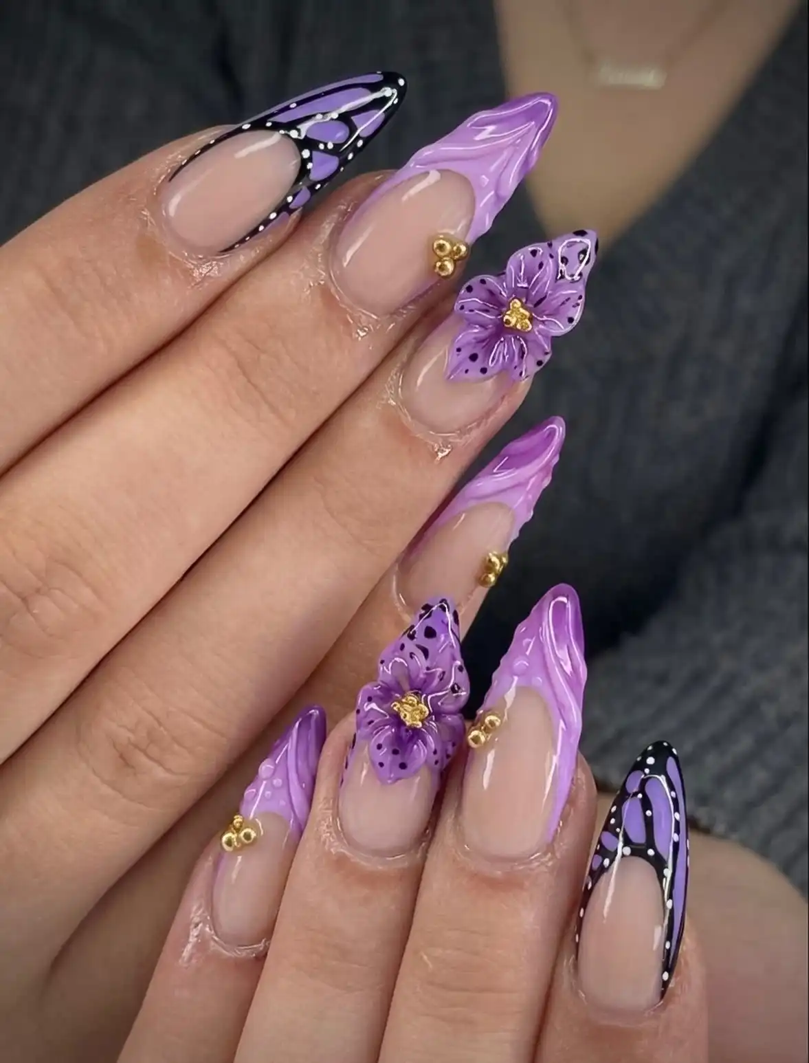 Sculpted purple tips with 3D flowers and gold bead accents