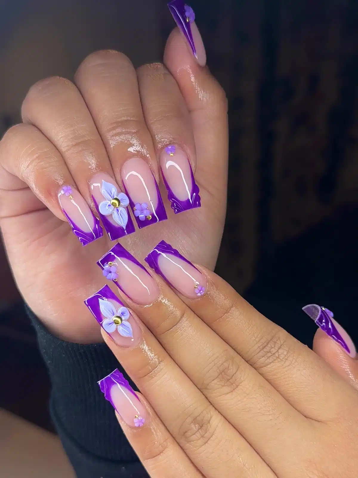 Bright purple French tips with 3D floral accents