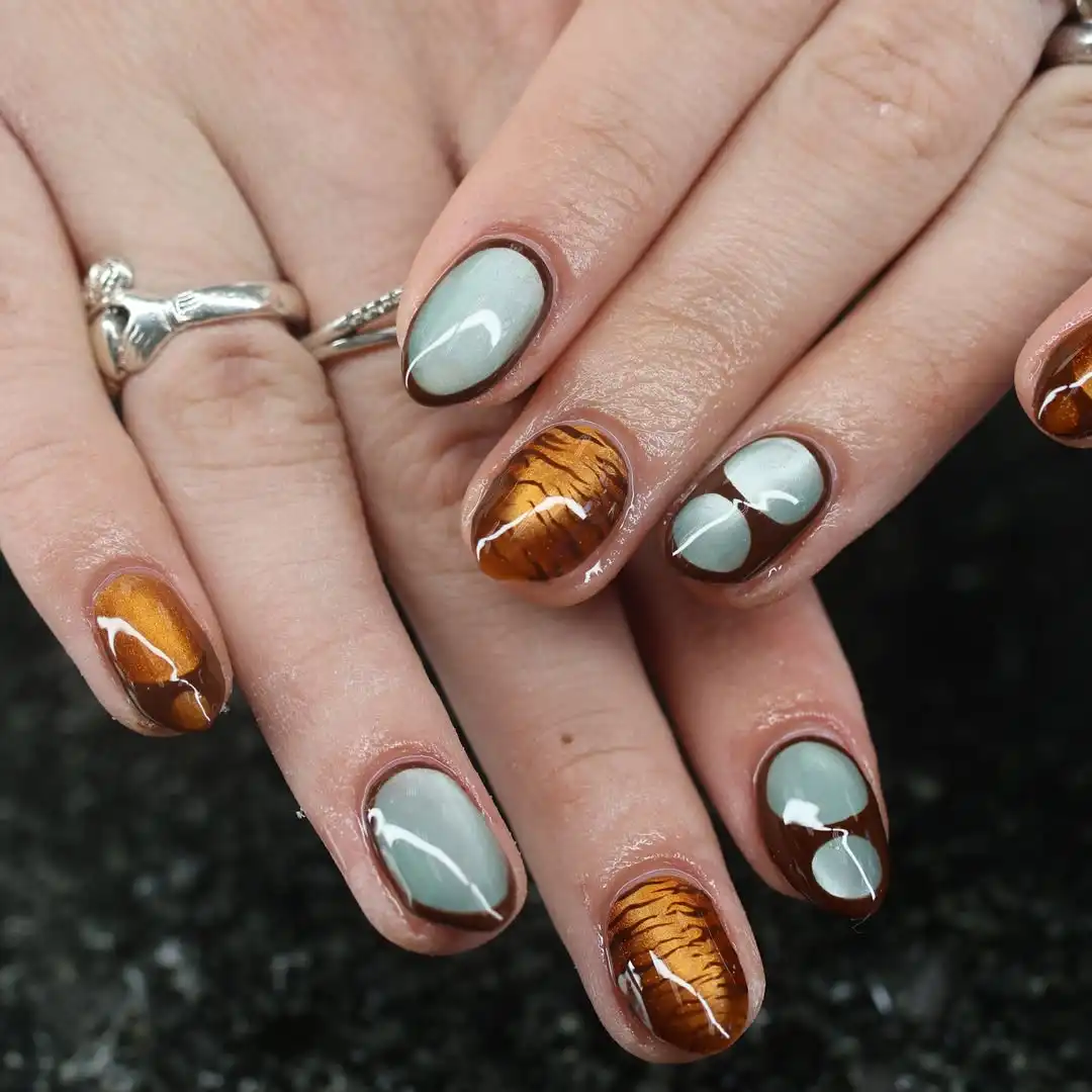 Gray and brown mix with striped accent nails
