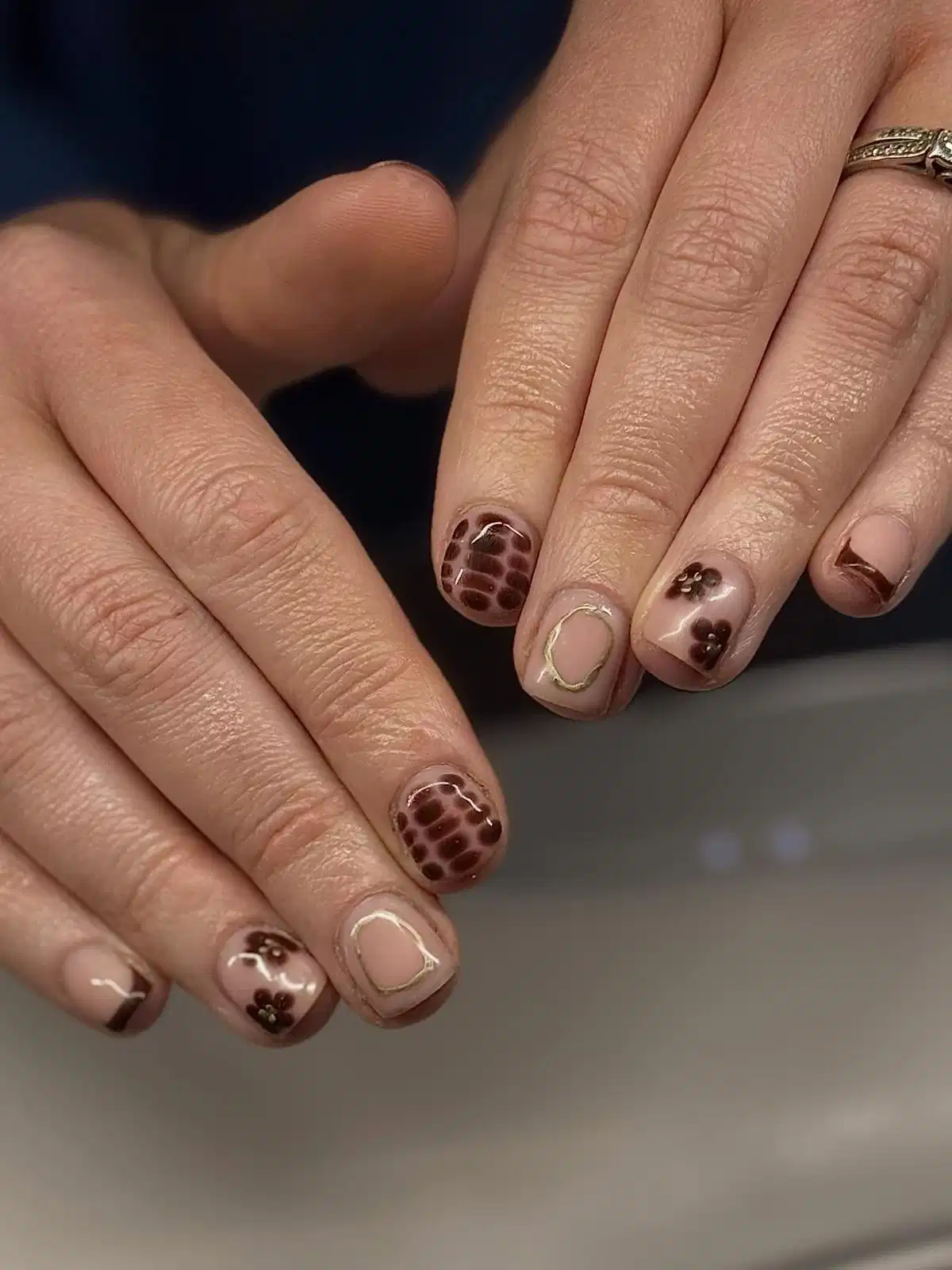 Nude and brown with French tips and patterned accents