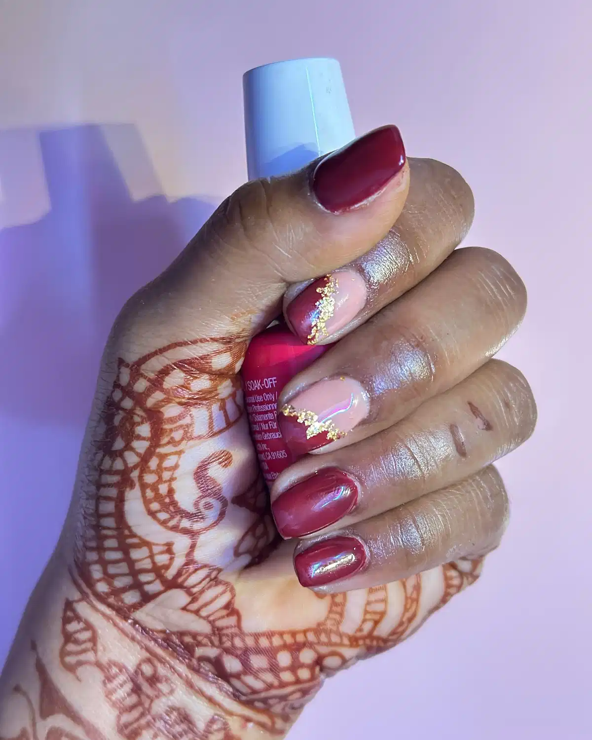Maroon and nude diagonals with a gold glitter stripe