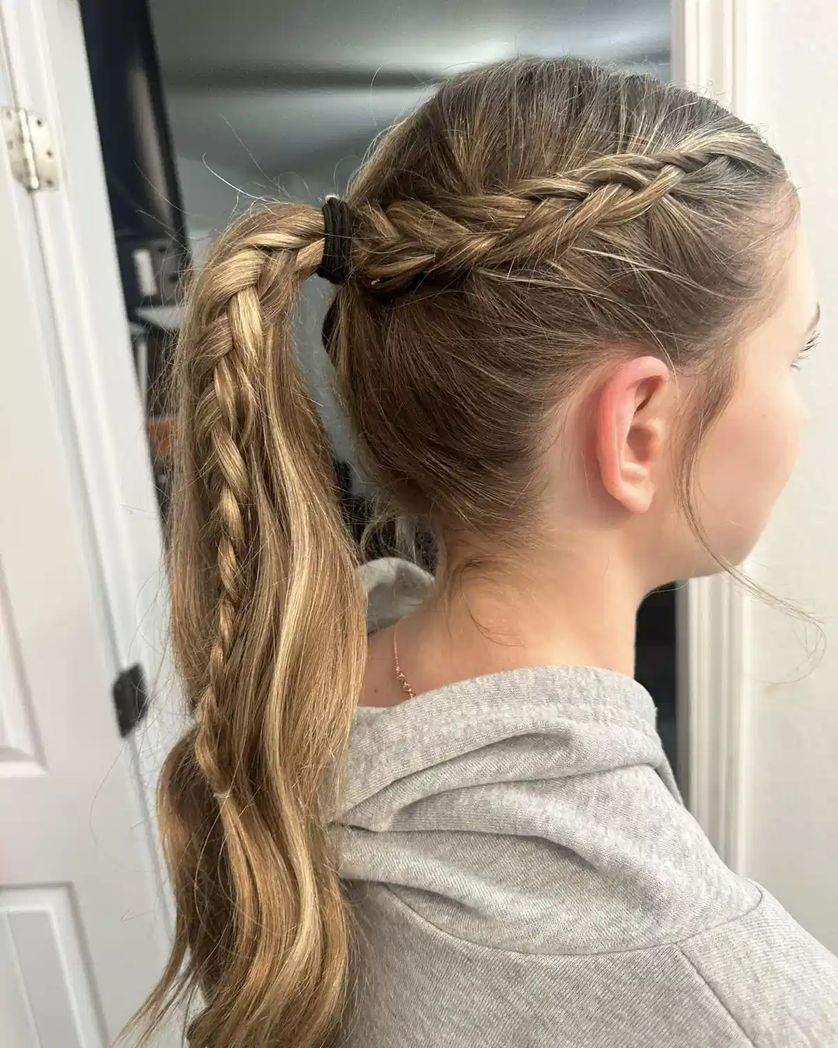High ponytail with side braid detail