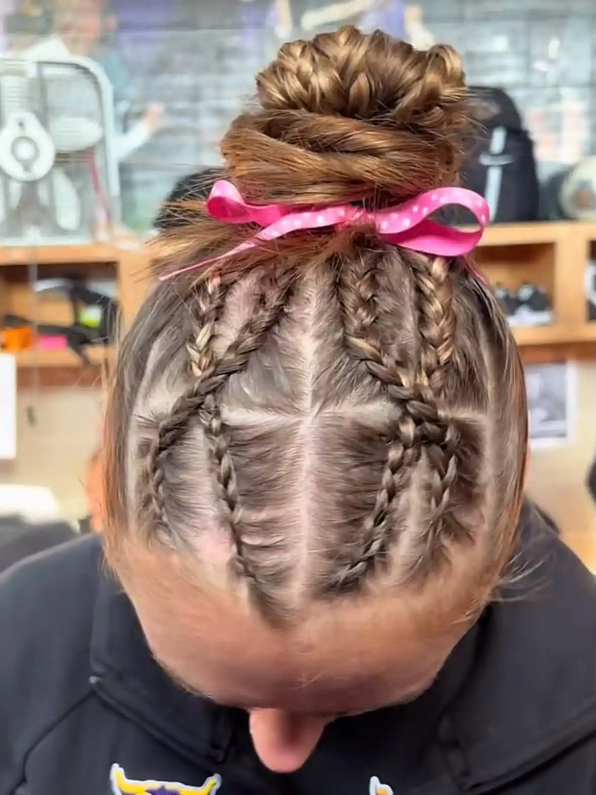 Braided top with bun and pink bow