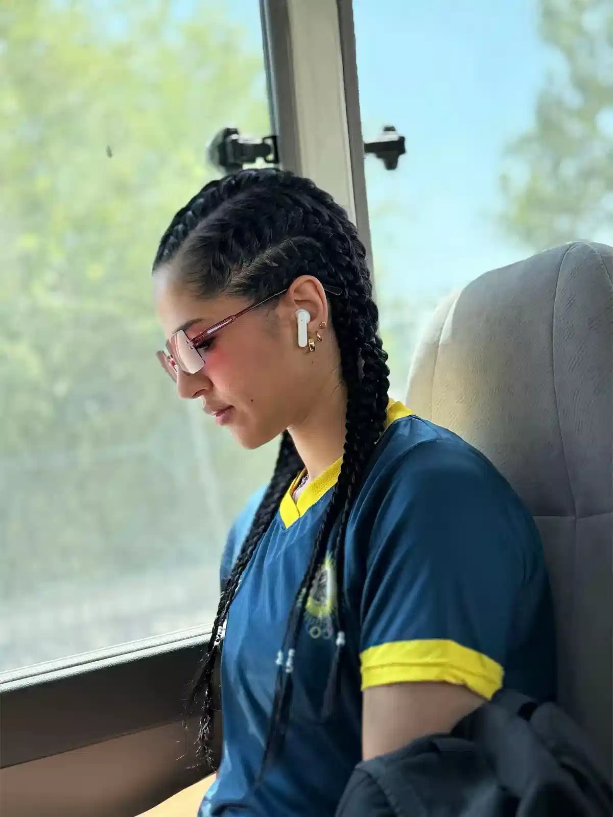 Double Long Braids with Pink-Tint Glasses