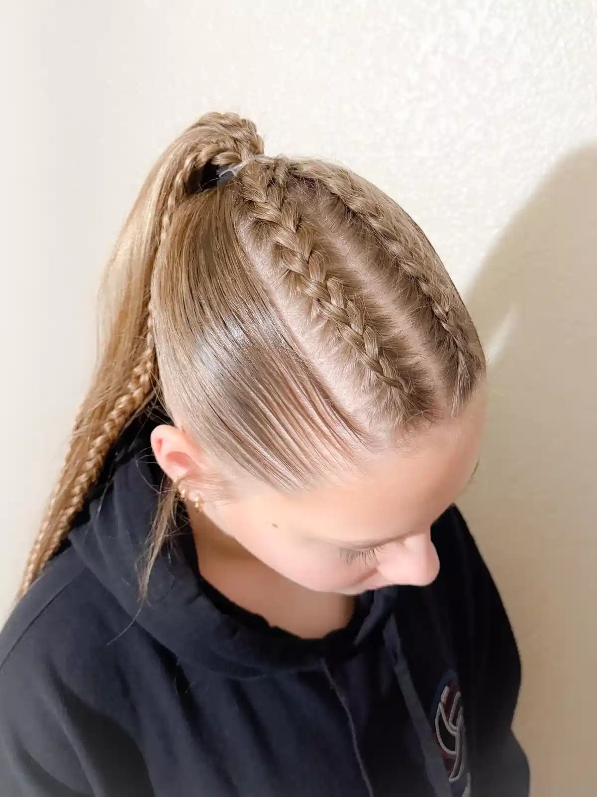 High ponytail with top braids