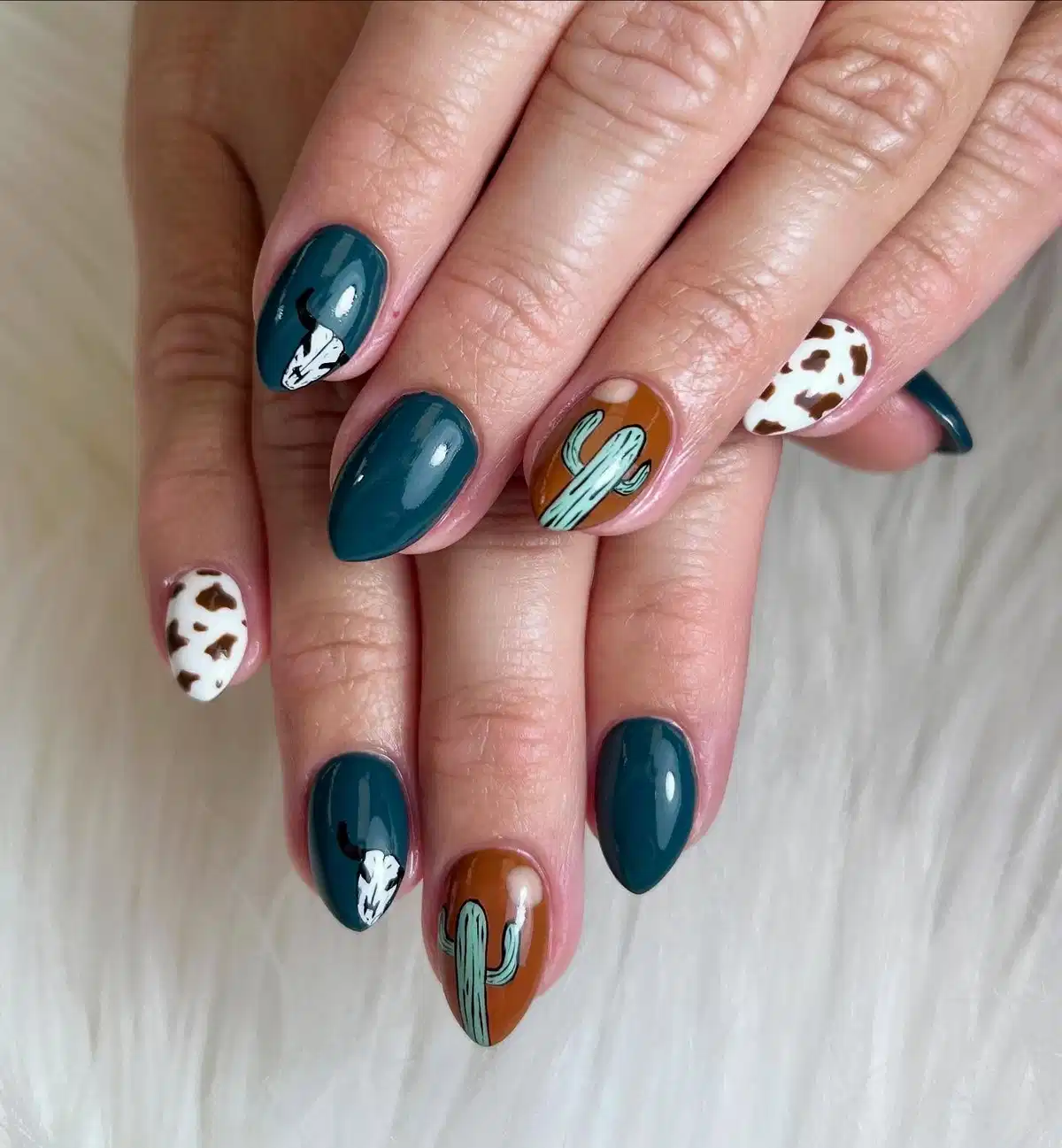 Dark teal solids with skull, cactus, and cow print accents