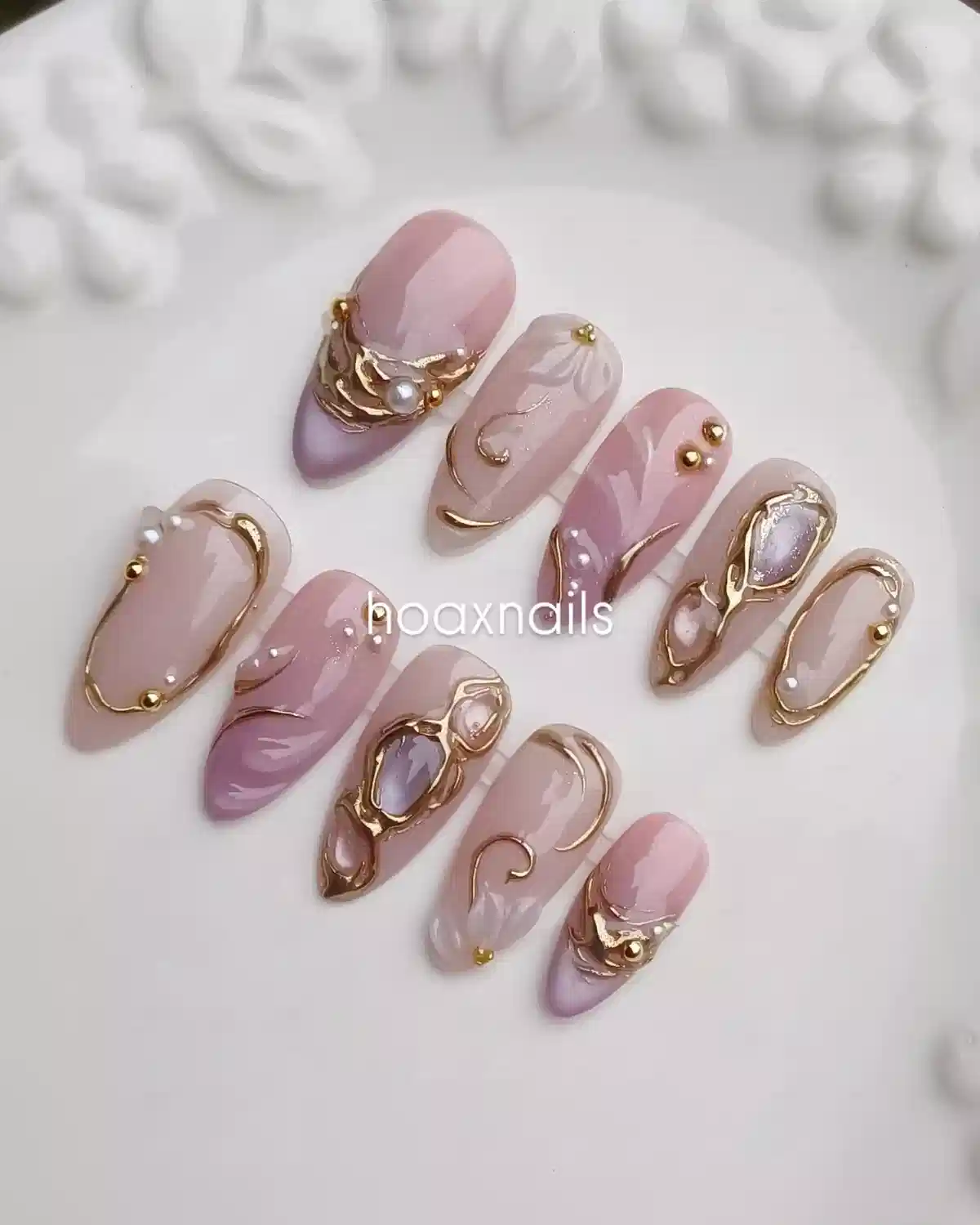Nude and lavender set with gold framing and pearl-like accents