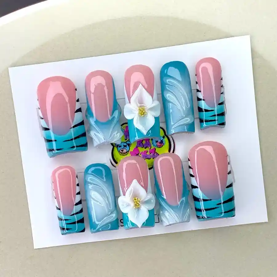 Teal and nude square tips with black stripes and 3D white flowers