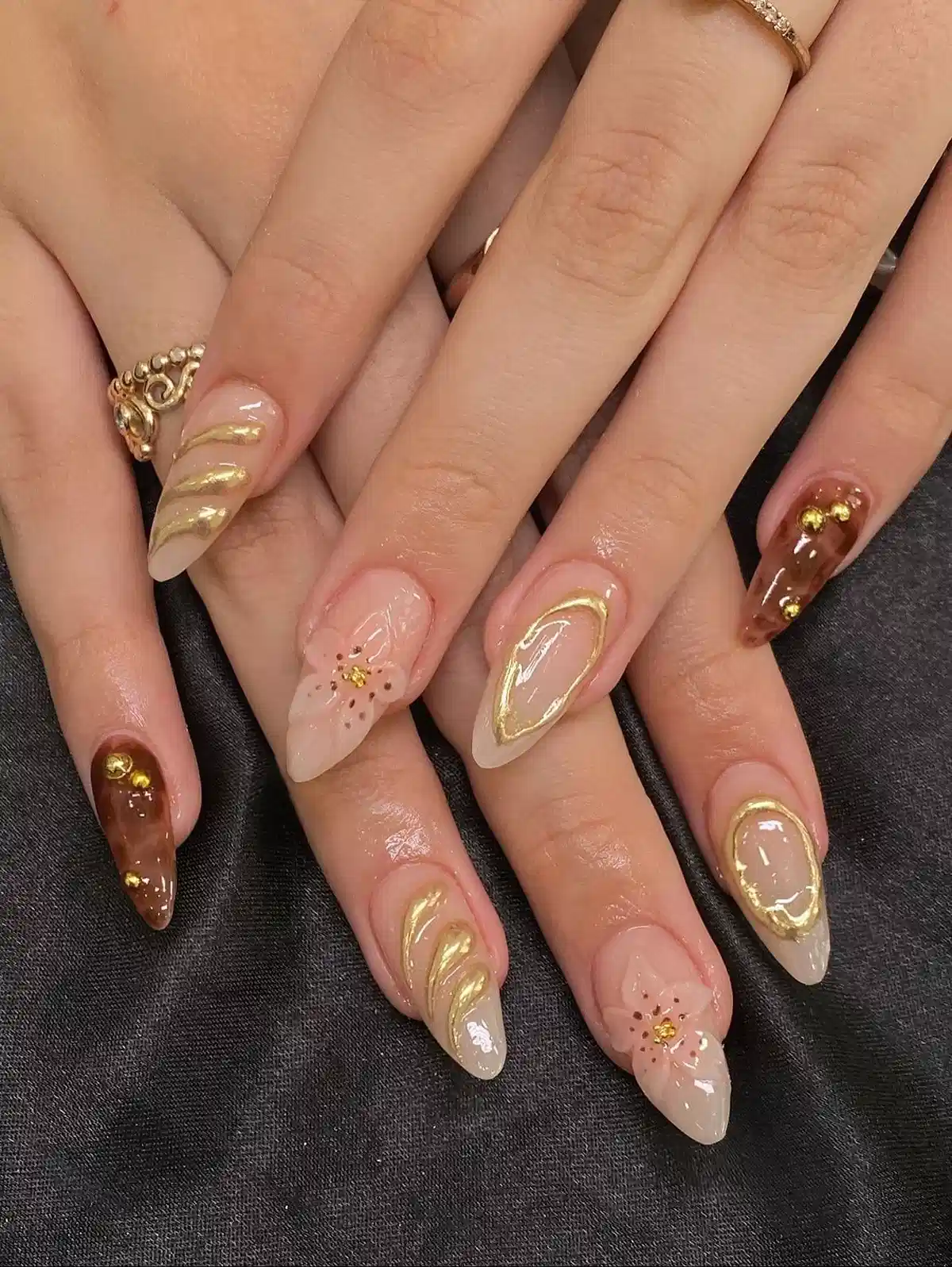 Nude and brown mix with gold swirls and stud accents