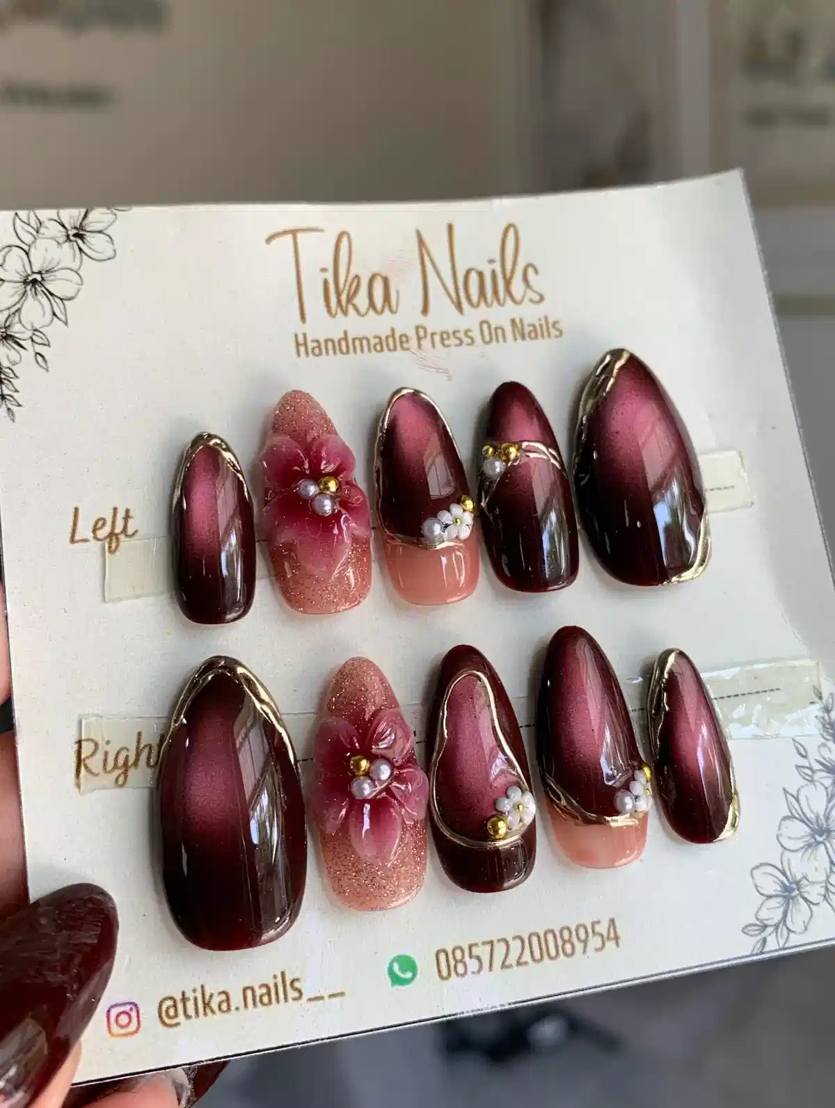 Burgundy set with raised pink flowers and gold outlines