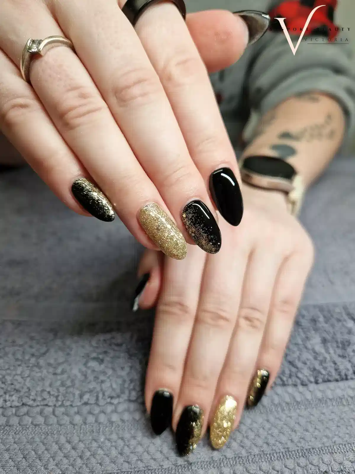 Black and gold glitter mix with gradient-style glitter tips