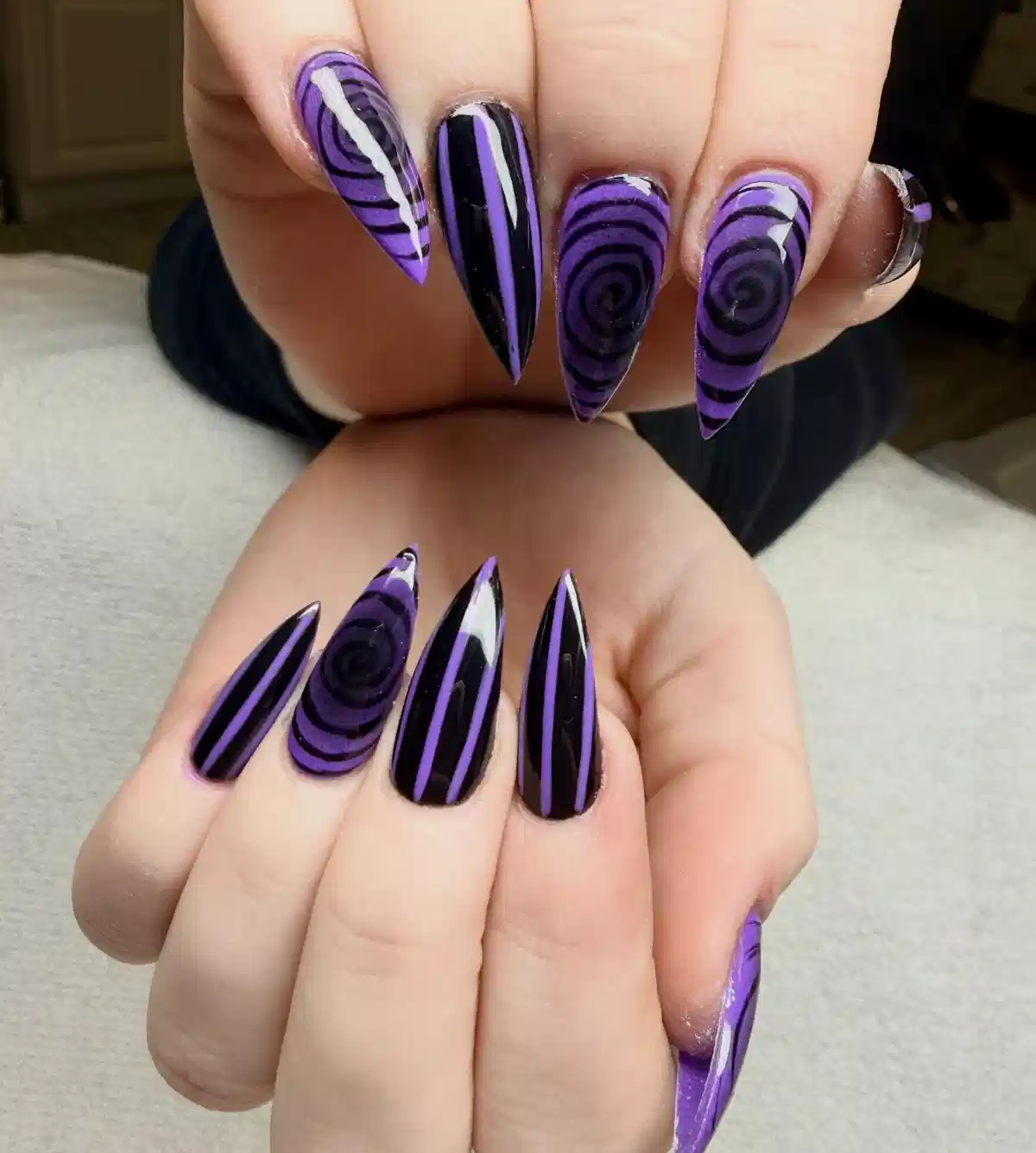 Black-and-purple stiletto set with spirals and stripes