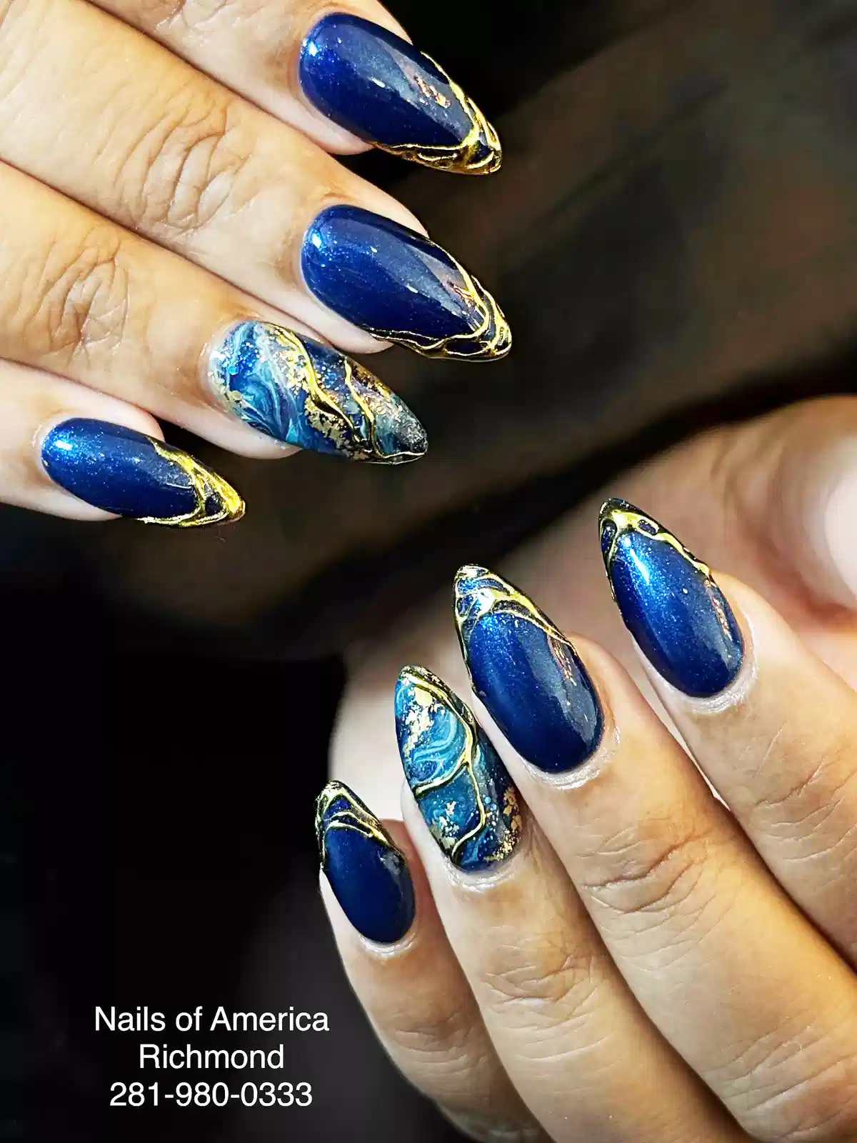 Deep shimmer blue with raised gold lines and marbled accents