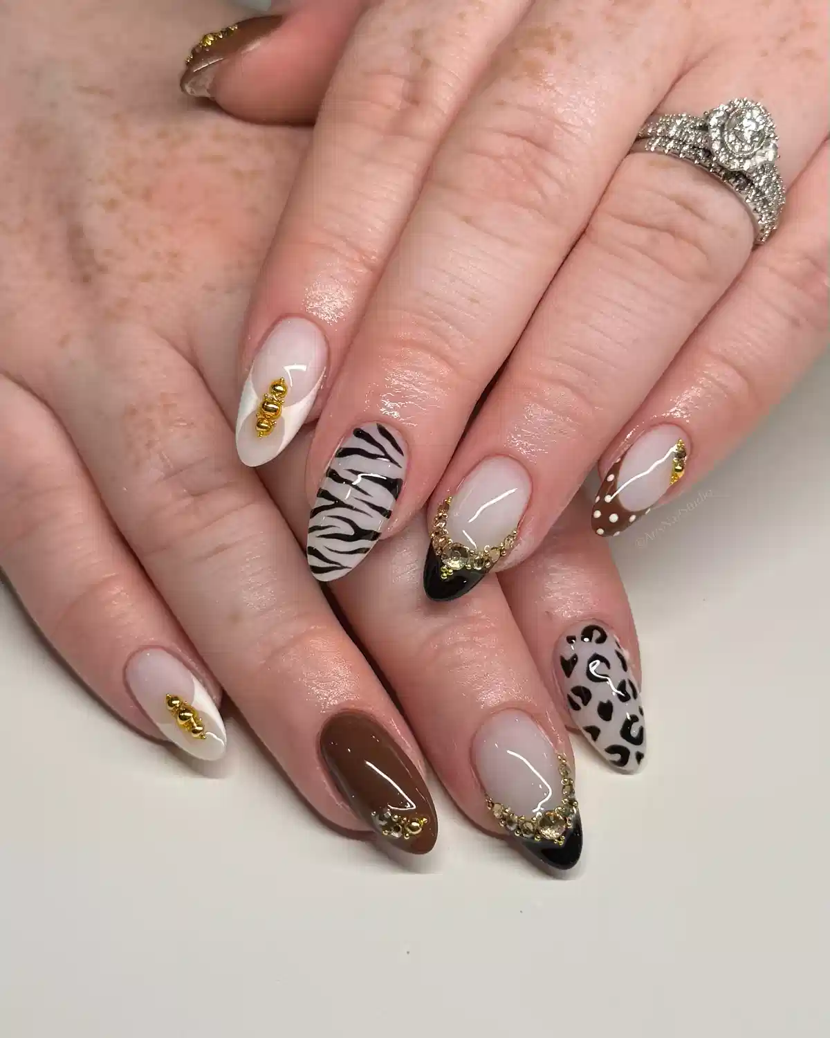 Animal-print accents with gold gem clusters and black-tipped details