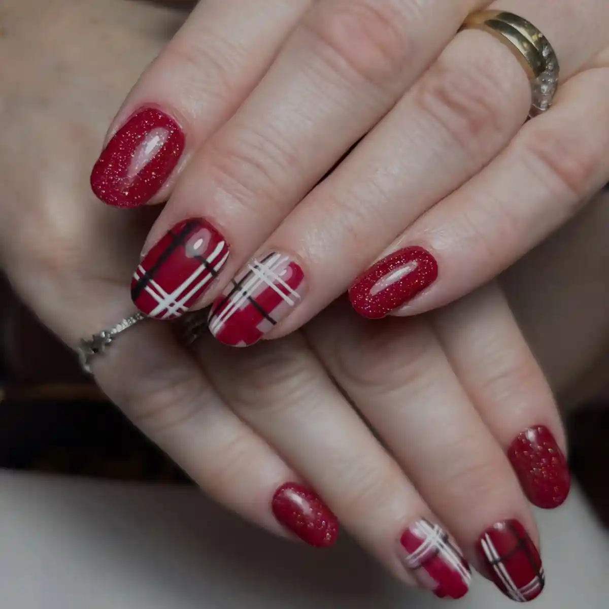 Red glitter solids with mixed red plaid accent nails