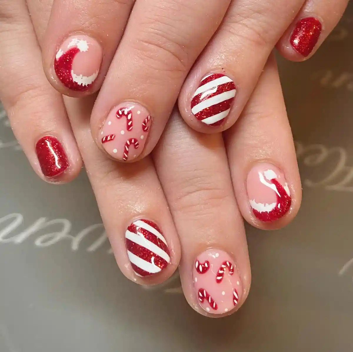 Red glitter with striped and candy-cane motifs (no plaid visible)