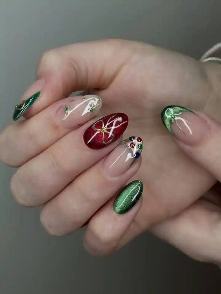 Green shimmer and nude mix with red accent and bow detail