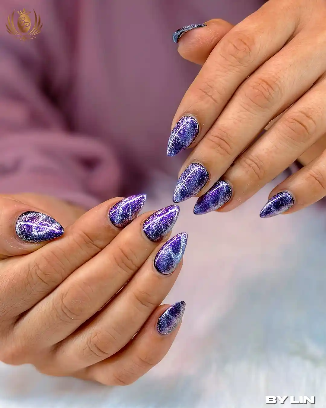 Shimmery reflective purple almond nails