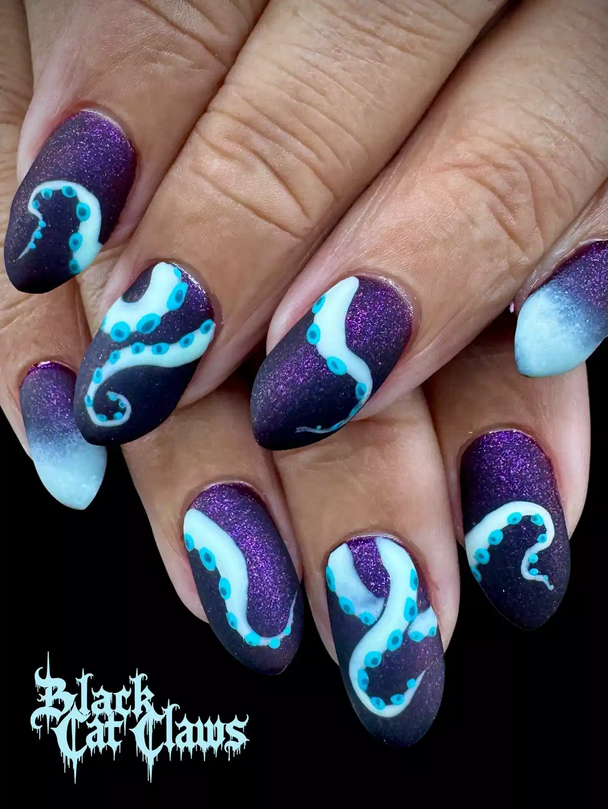 Matte shimmery purple with white-and-turquoise tentacle art