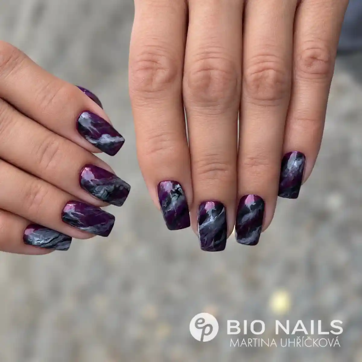 Glossy deep purple and charcoal marble nails