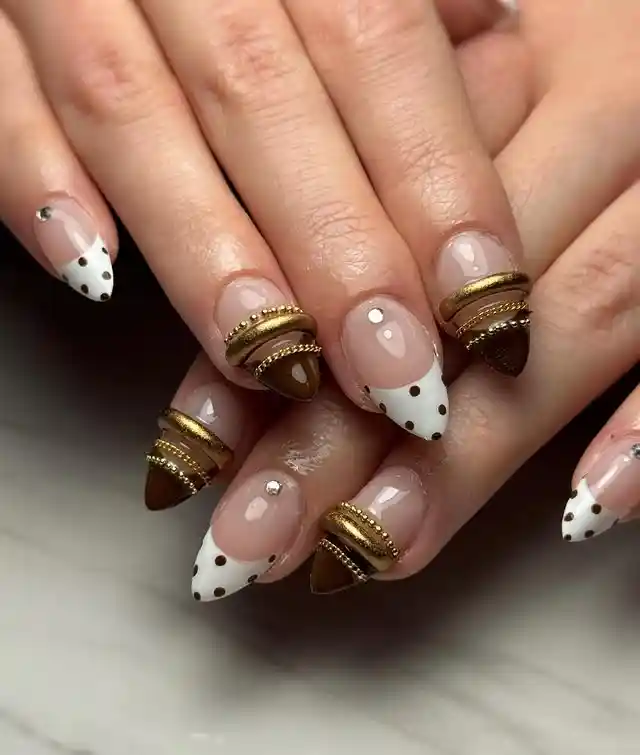 Mixed polka-dot French tips with brown-and-gold accents