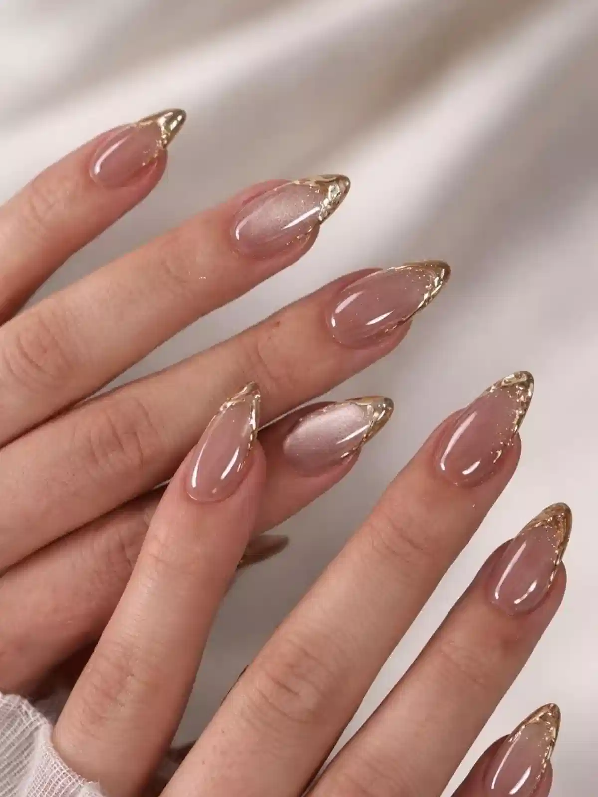 Nude Almond Nails with Thin Gold Tip Outlines