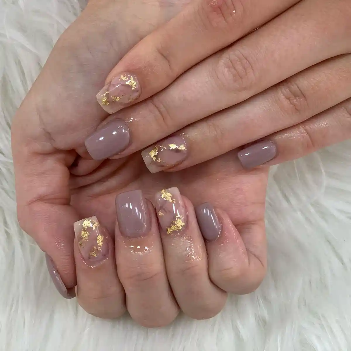 Taupe-and-sheer mix with gold foil accent nails