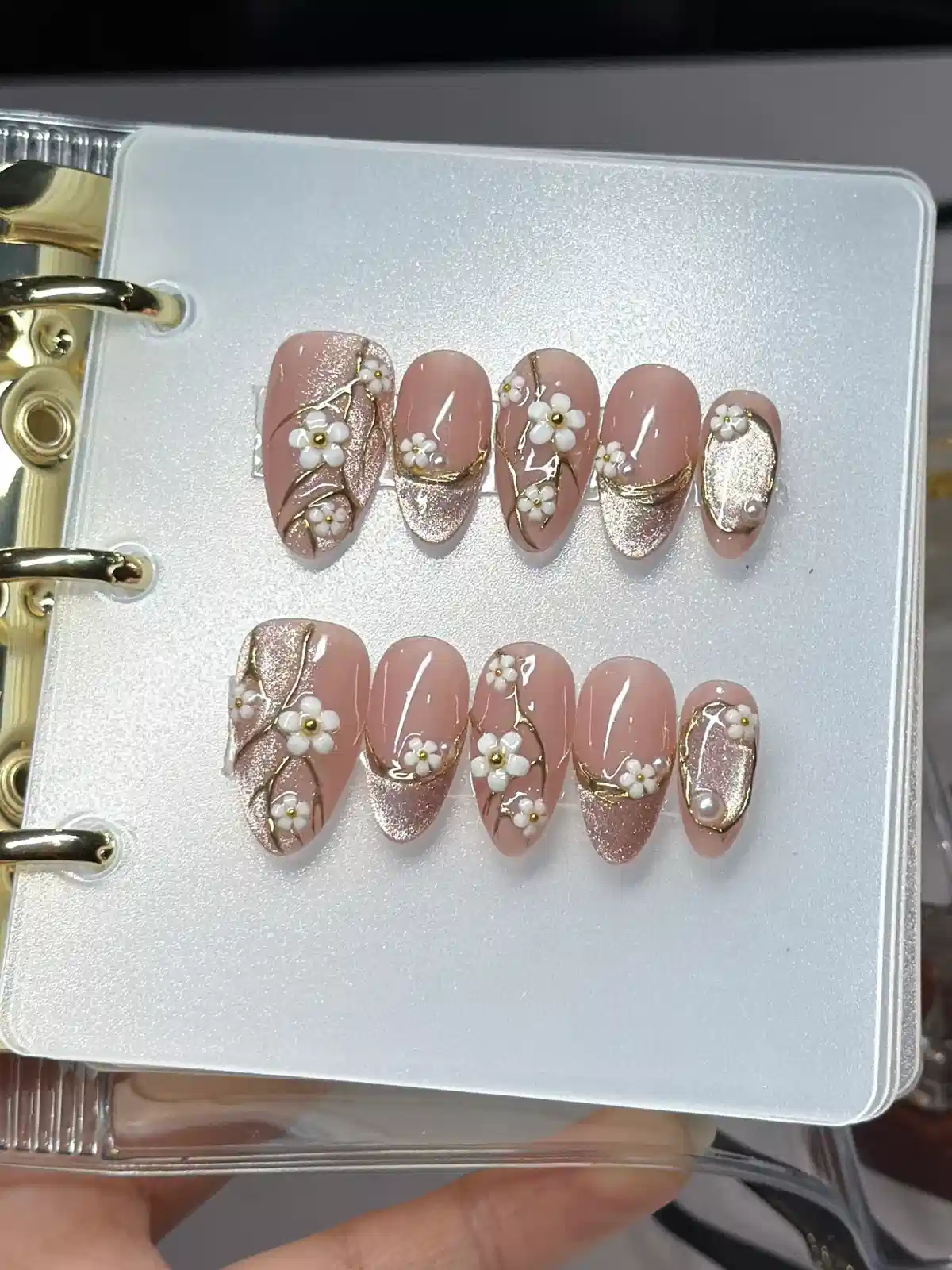 Nude set with glitter panels, gold lines, and 3D white flowers