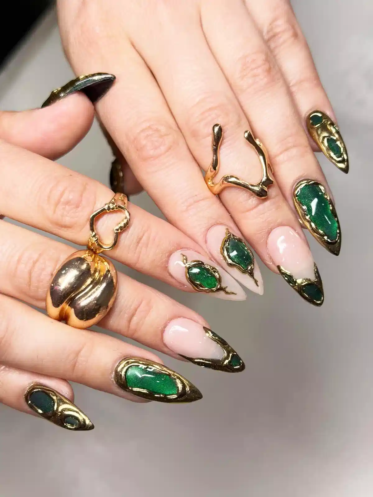 Green Inset Nails Framed in Thick Gold
