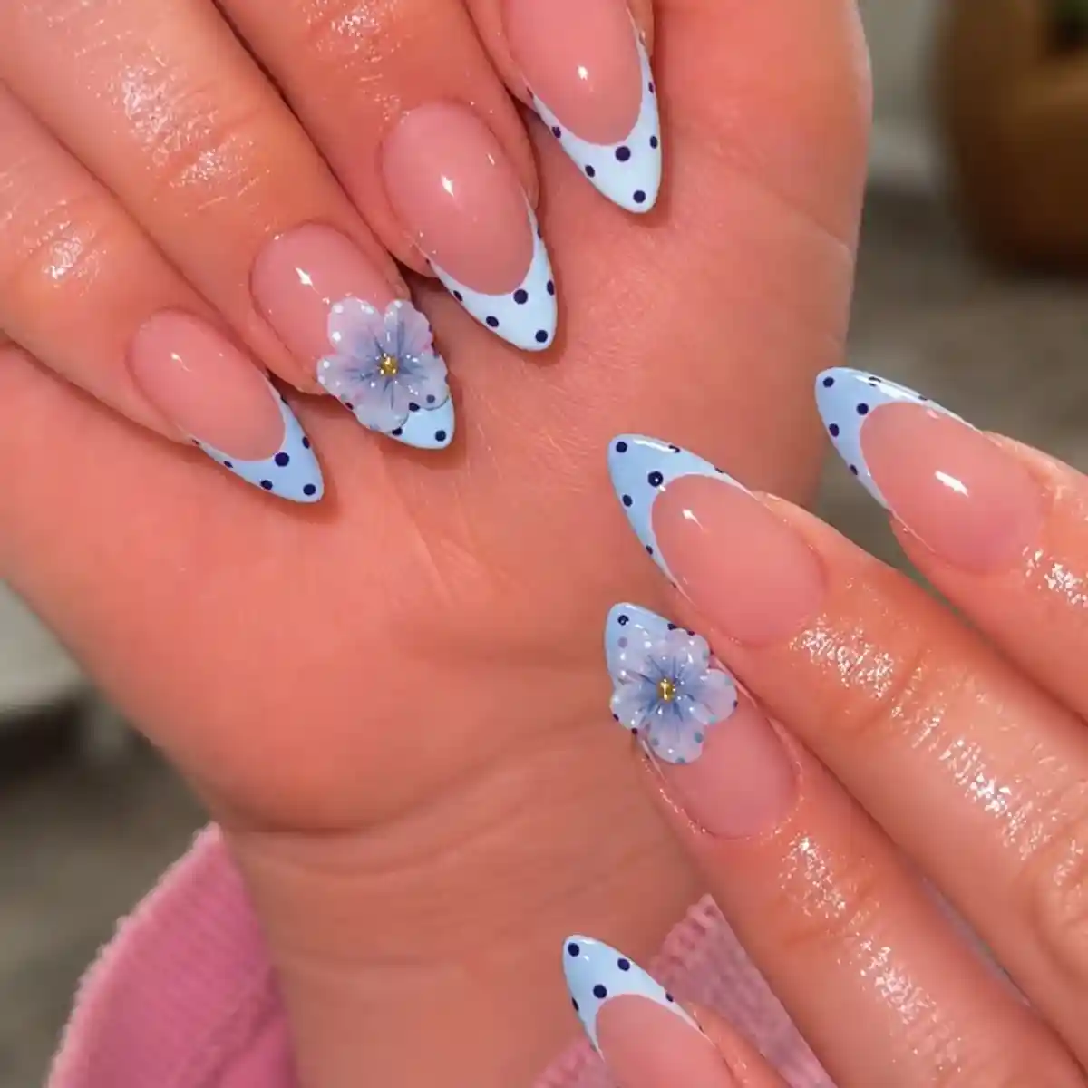 Light-blue polka-dot French tips with 3D flowers