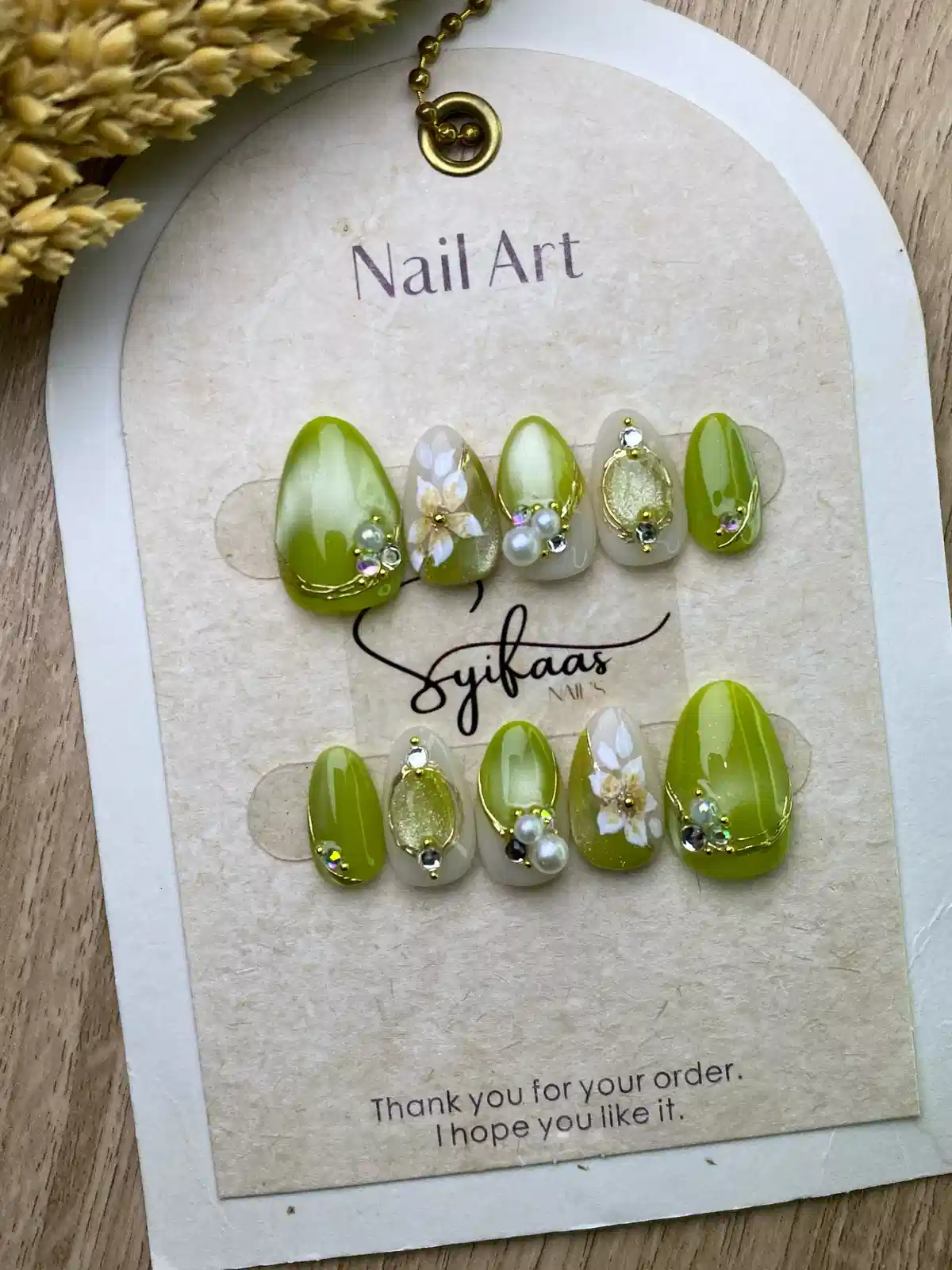 Yellow-green press-on set with pearls, rhinestones, and florals