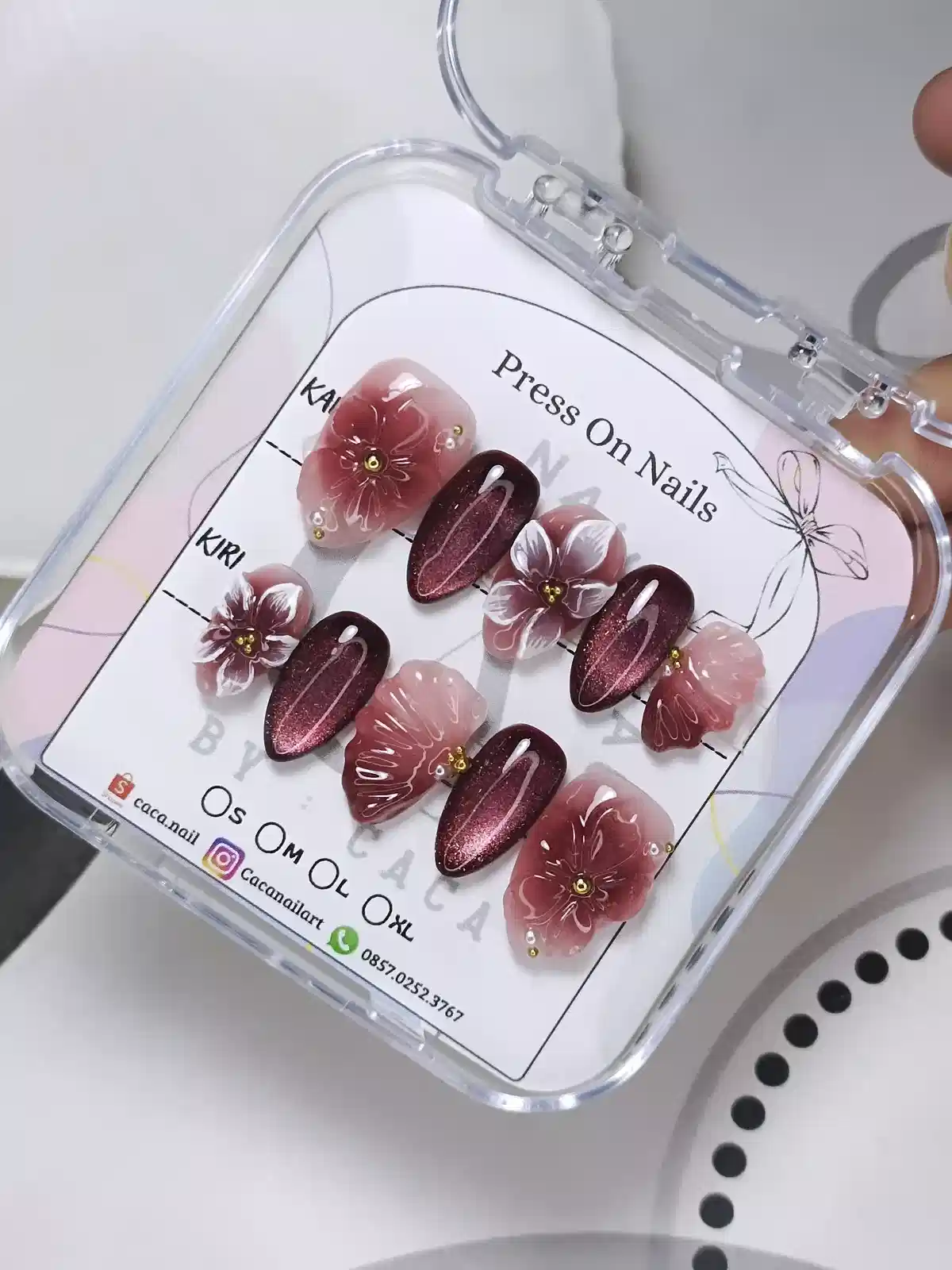 Burgundy and translucent floral set on a size chart card