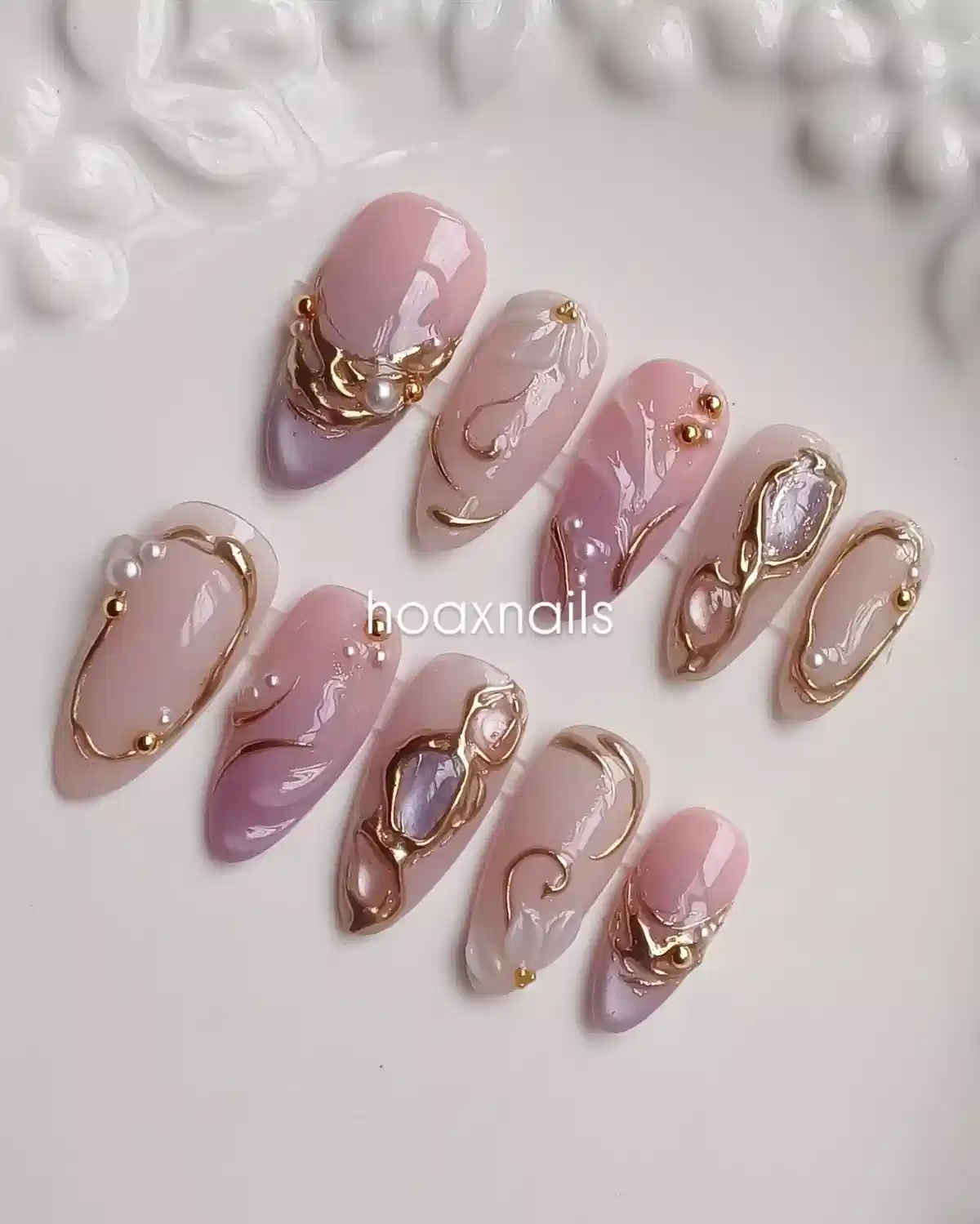 Soft pink-lavender set with raised gold frames and pearl accents