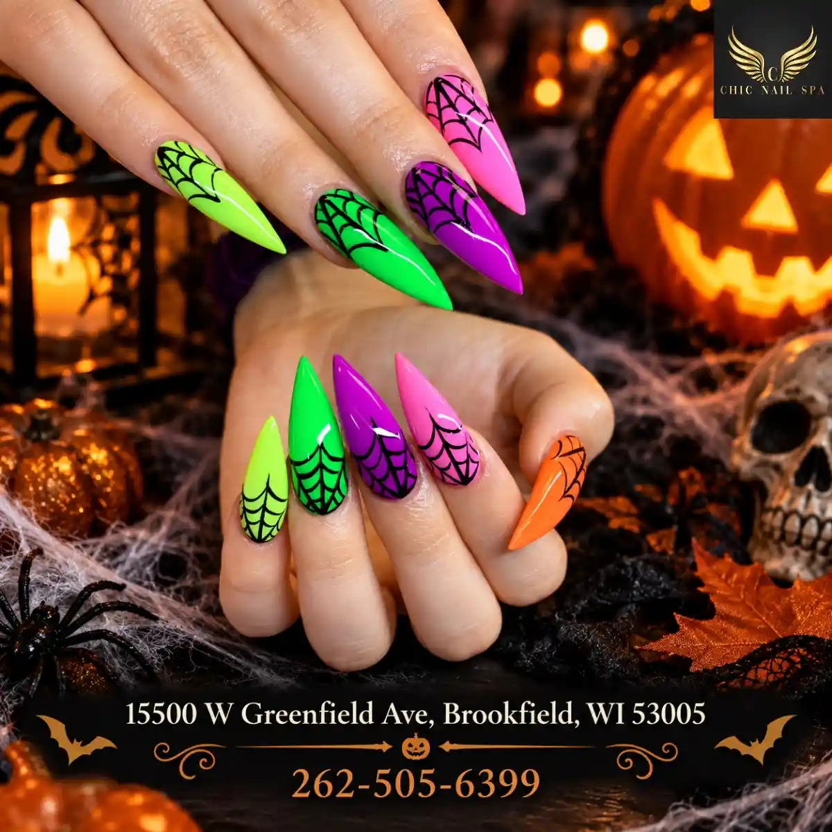 Neon stiletto nails with black spiderweb lines