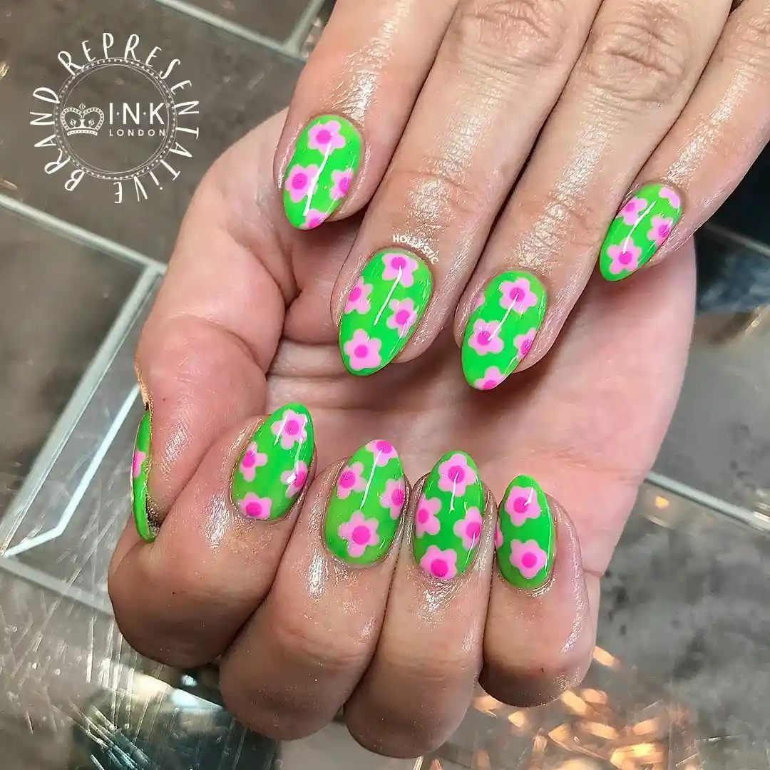 Green nails with pink floral pattern