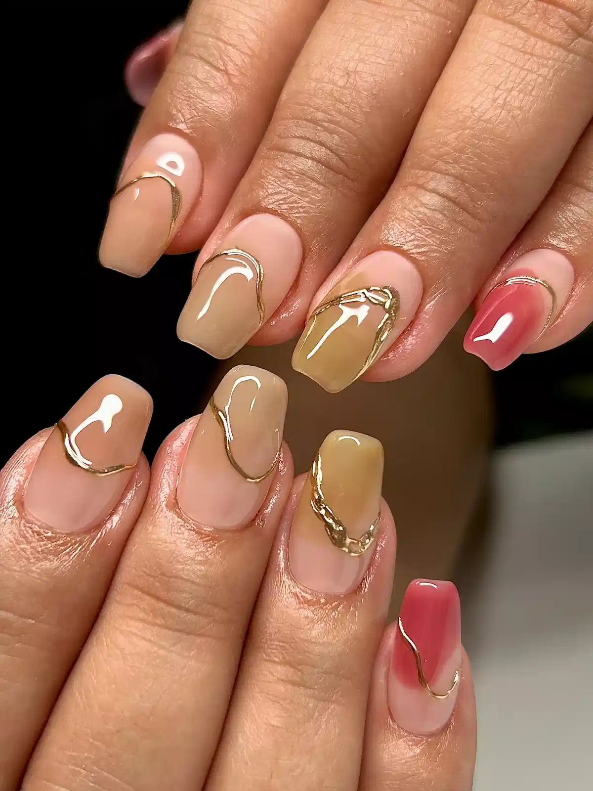 Glossy nude and beige blocks with irregular gold outlines