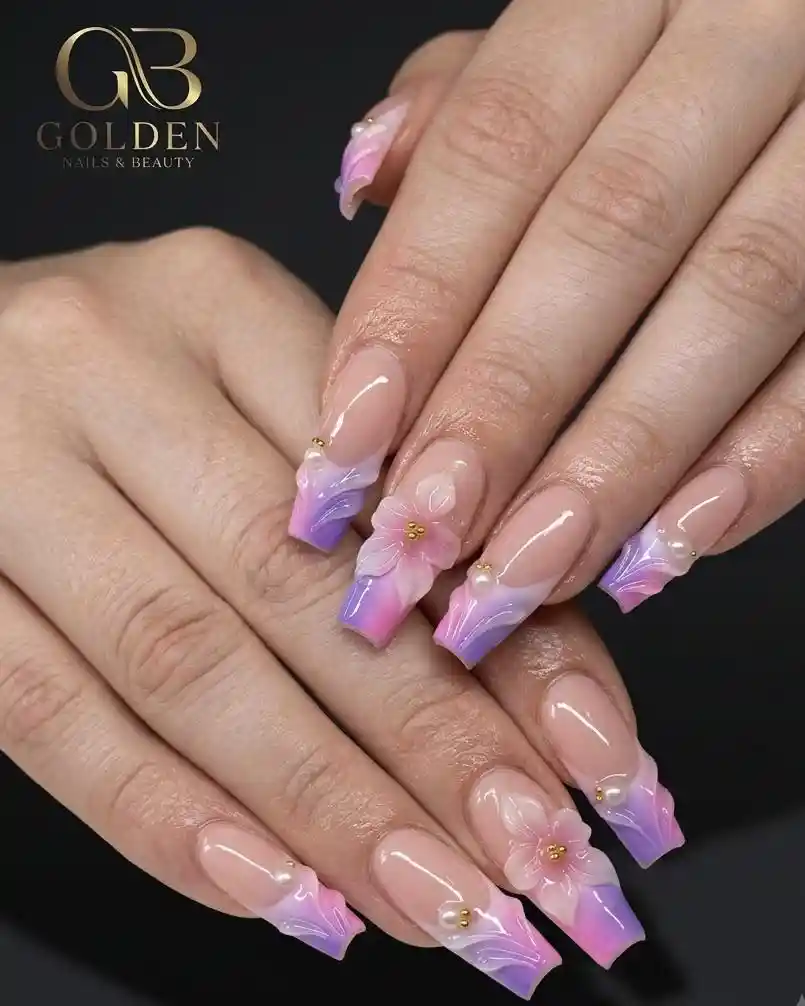 Nude base with pink-purple French tips and floral accents