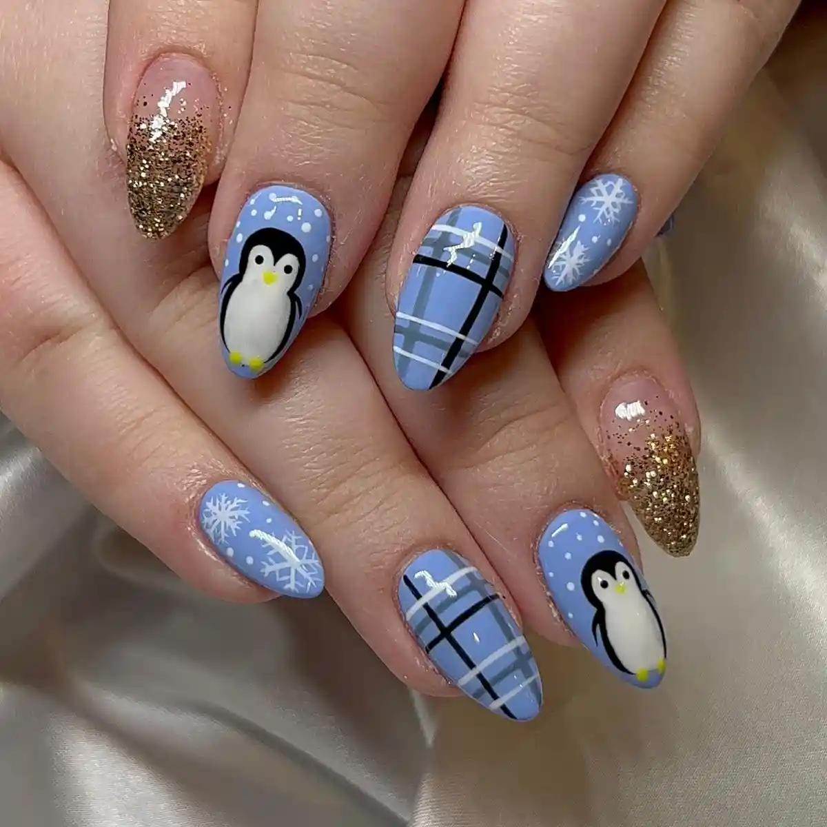 Light blue plaid with snowflakes, penguins, and gold-glitter tips