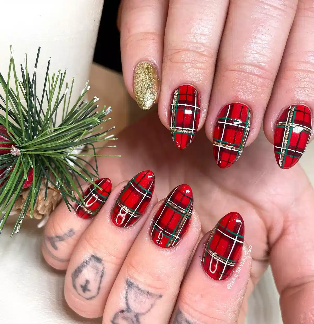 Bright Red Plaid Nails with a Gold Glitter Accent