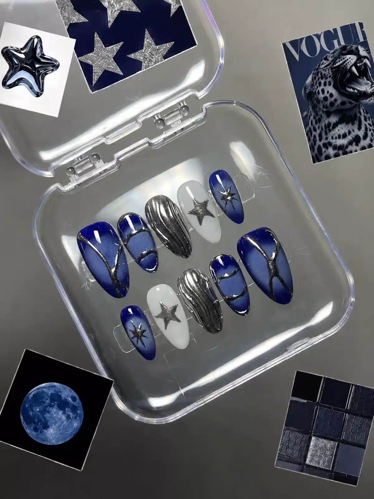 Deep blue and silver star-themed press-ons in a clear case