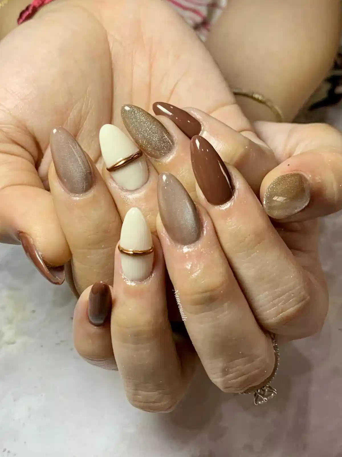 Mixed brown, taupe, and cream set with metallic band detail