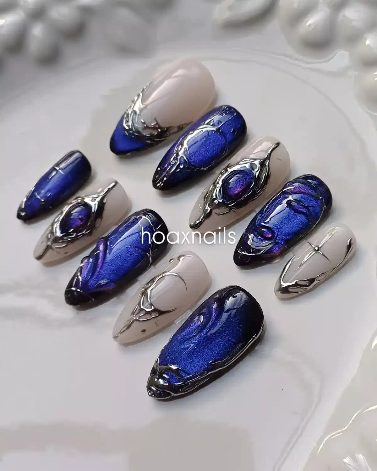 Cobalt blue and nude set with raised silver-toned 3D framing