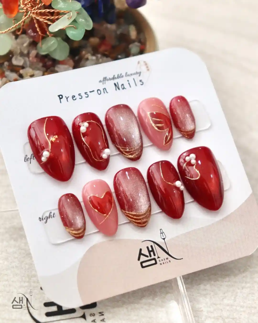 Red and pink glossy set with heart detail and pearl-like accents