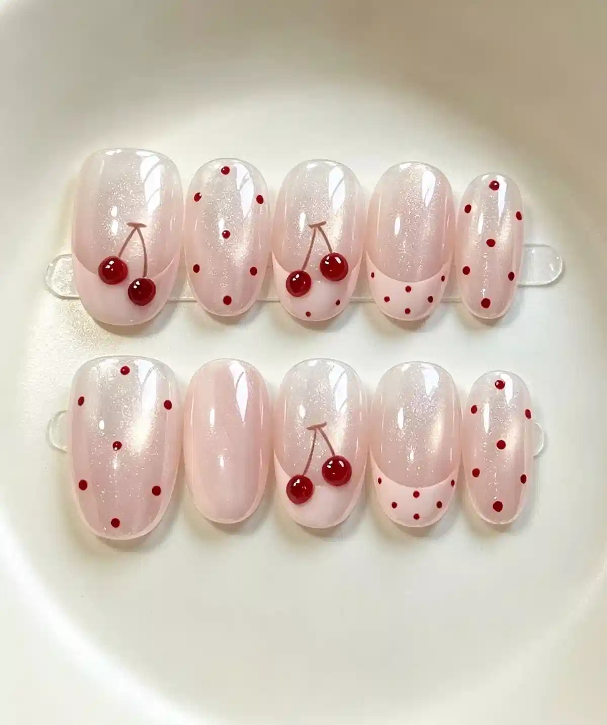 Shimmery pale pink set with red polka dots and 3D cherry accents