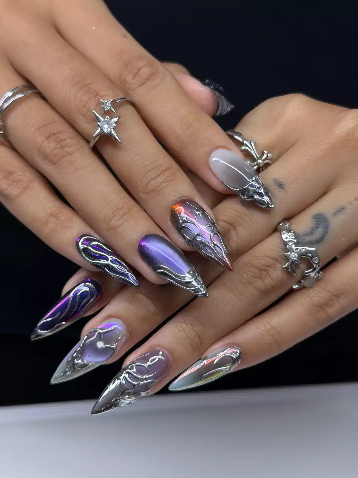 Chrome silver linework over purple and iridescent bases