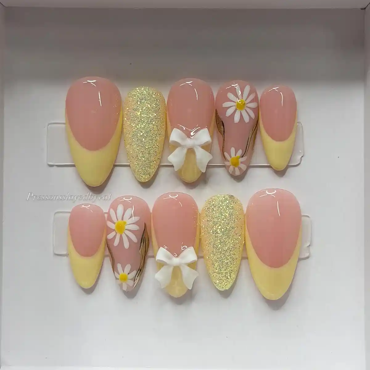 Peach and yellow set with daisies, bows, and gold glitter